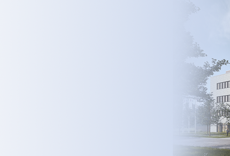 Nouveau bâtiment du laboratoire médical de Brême avec trois étages, de grandes fenêtres et un hall d'entrée, entouré d'arbres et d'espaces verts.